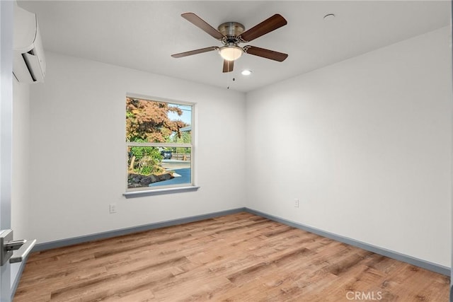 8412 Montna Dr, Paradise, CA 95969 - empty room featuring a wall mounted AC, wood finished floors, ceiling fan, and recessed lighting