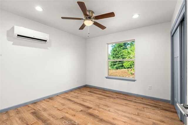 8412 Montna Dr, Paradise, CA 95969 - spare room featuring an AC wall unit, light wood-style floors, recessed lighting, and a ceiling fan