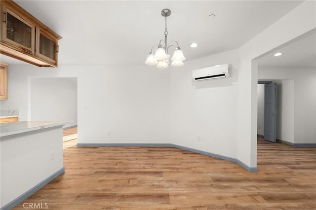 8412 Montna Dr, Paradise, CA 95969 - unfurnished dining area featuring a wall mounted air conditioner, a chandelier, recessed lighting, and light wood finished floors