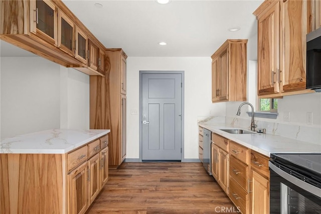 8412 Montna Dr, Paradise, CA 95969 - kitchen featuring stainless steel dishwasher, wood finished floors, glass insert cabinets, light stone countertops, and recessed lighting