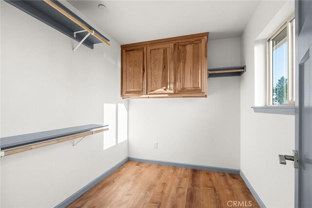 8412 Montna Dr, Paradise, CA 95969 - walk in closet featuring light wood-type flooring