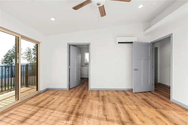 8412 Montna Dr, Paradise, CA 95969 - unfurnished bedroom with a wall mounted AC, access to exterior, light wood-type flooring, recessed lighting, and a ceiling fan