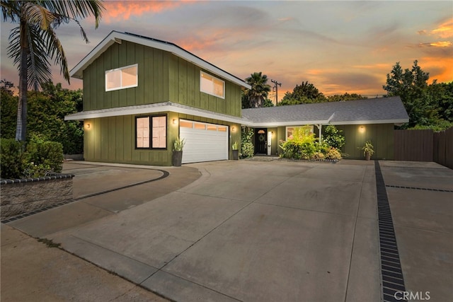 23076 Dune Mear Rd, Lake Forest, CA 92630 - view of front of home featuring board and batten siding, an attached garage, and concrete driveway