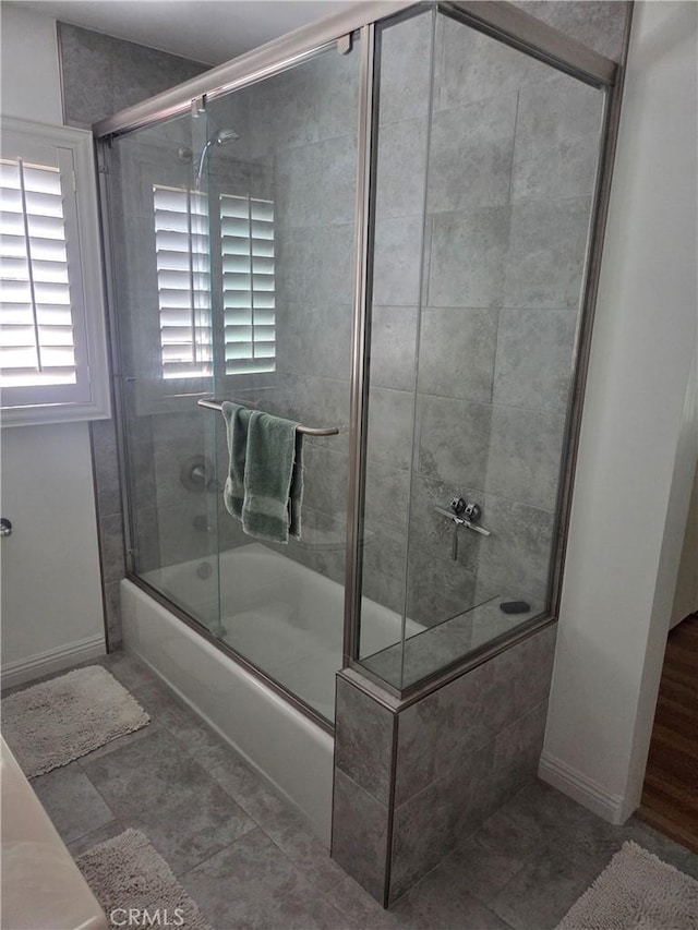 20450 Bassett St, Winnetka, CA 91306 - bathroom featuring enclosed tub / shower combo and tile patterned floors