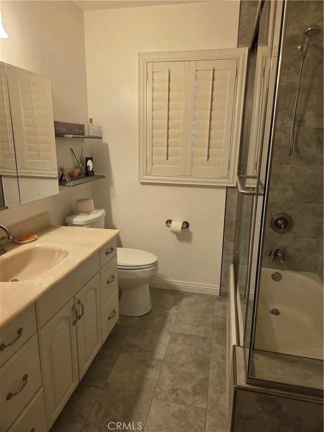 20450 Bassett St, Winnetka, CA 91306 - bathroom featuring vanity, shower / bath combination with glass door, and tile patterned floors