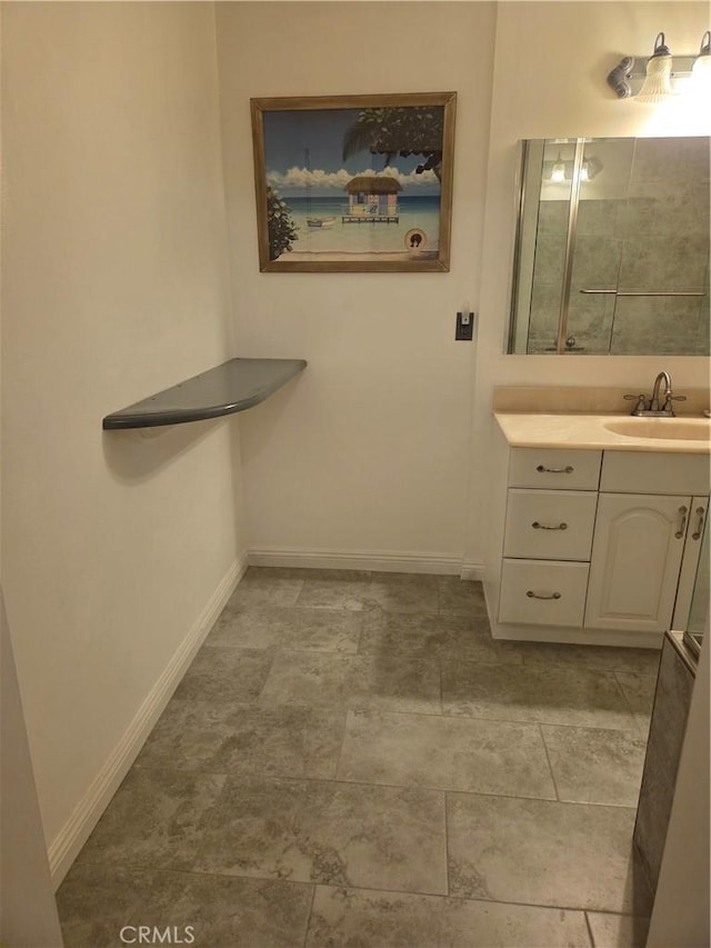 20450 Bassett St, Winnetka, CA 91306 - bathroom featuring baseboards and vanity