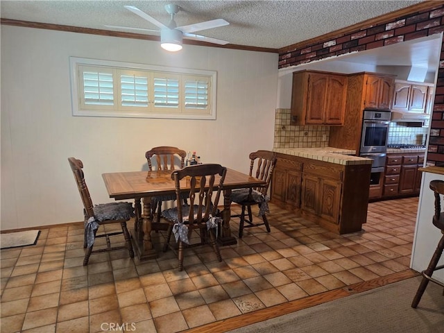 20450 Bassett St, Winnetka, CA 91306 - dining space featuring crown molding, a ceiling fan, and a textured ceiling