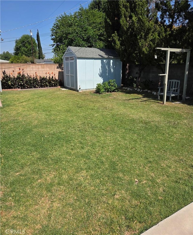 20450 Bassett St, Winnetka, CA 91306 - fenced backyard featuring a storage unit