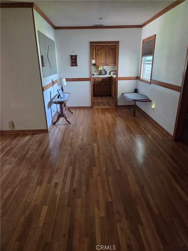 20450 Bassett St, Winnetka, CA 91306 - unfurnished living room with wood finished floors, ornamental molding, and a textured ceiling