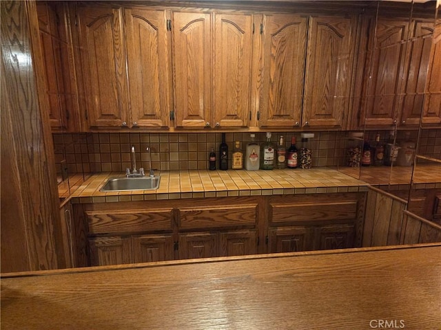 20450 Bassett St, Winnetka, CA 91306 - kitchen featuring tile counters and backsplash