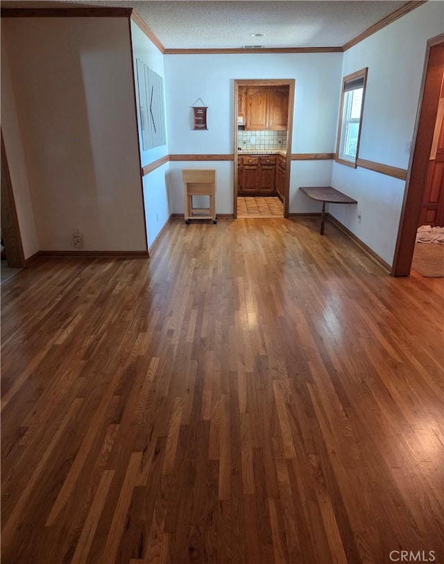 20450 Bassett St, Winnetka, CA 91306 - unfurnished living room featuring ornamental molding and wood finished floors