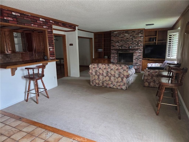20450 Bassett St, Winnetka, CA 91306 - living area featuring crown molding, a textured ceiling, a fireplace, light carpet, and built in shelves