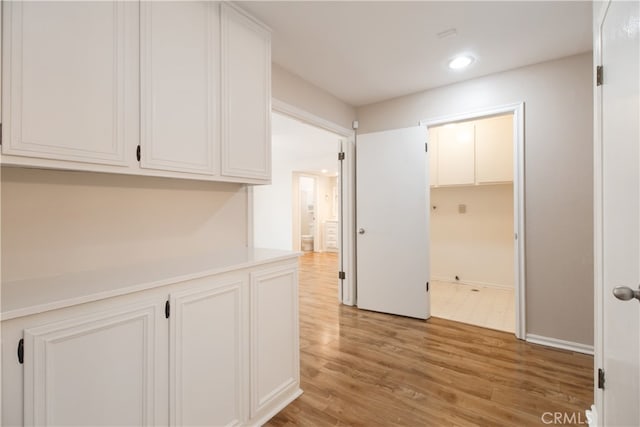 10025 Lubao Ave, Chatsworth, CA 91311 - corridor with light wood-style floors and recessed lighting