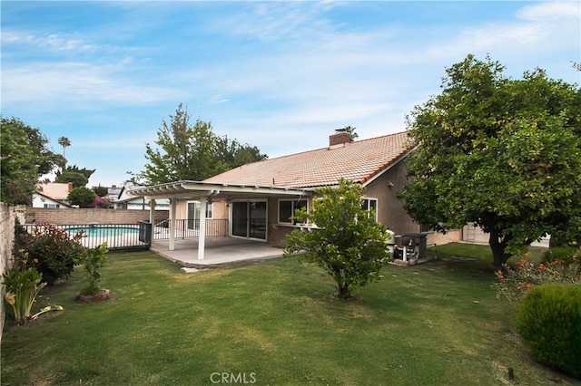 10025 Lubao Ave, Chatsworth, CA 91311 - back of property with a chimney, a tile roof, a patio, and stucco siding