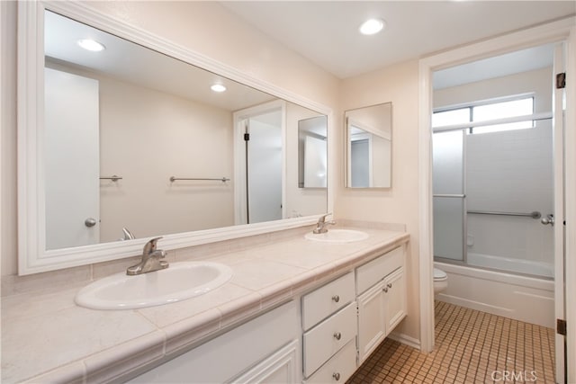 10025 Lubao Ave, Chatsworth, CA 91311 - full bath with double vanity, bath / shower combo with glass door, recessed lighting, and tile patterned flooring