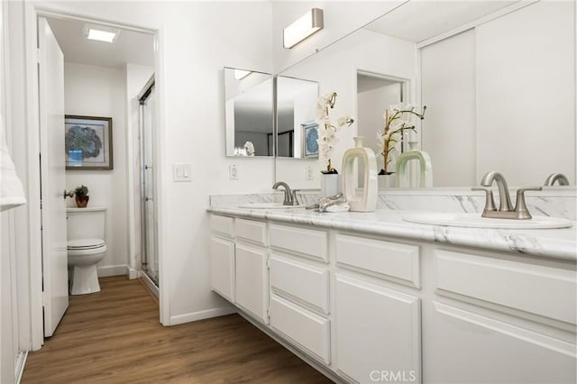 38 Woodleaf, Irvine, CA 92614 - full bath featuring double vanity, wood finished floors, and a shower with shower door
