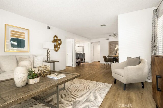38 Woodleaf, Irvine, CA 92614 - living room featuring ceiling fan and light wood finished floors