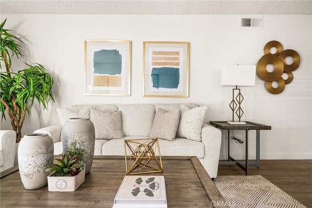 38 Woodleaf, Irvine, CA 92614 - living area featuring wood finished floors and a textured ceiling