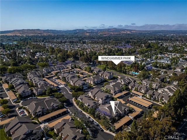 38 Woodleaf, Irvine, CA 92614 - aerial view of property's location featuring a mountain backdrop and nearby suburban area