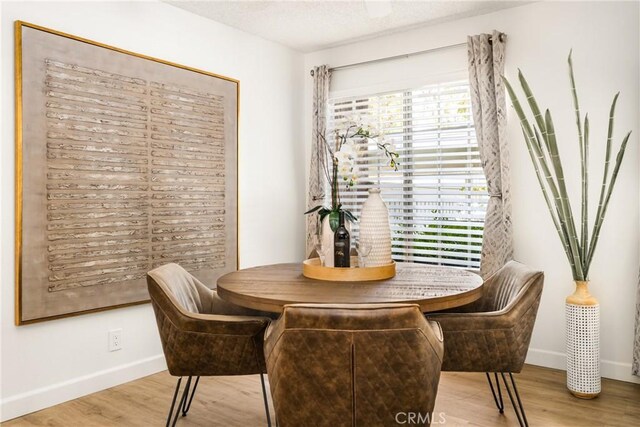 38 Woodleaf, Irvine, CA 92614 - dining area featuring wood finished floors and a textured ceiling