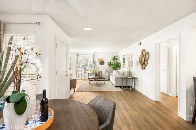 38 Woodleaf, Irvine, CA 92614 - living room featuring light wood finished floors and a textured ceiling