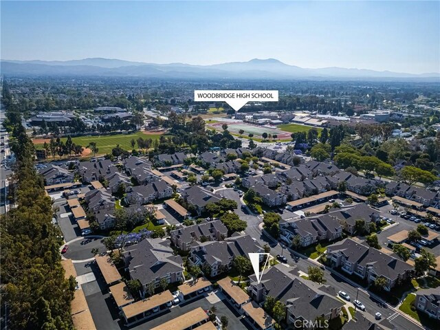 38 Woodleaf, Irvine, CA 92614 - aerial overview of property's location featuring a mountain backdrop and nearby suburban area