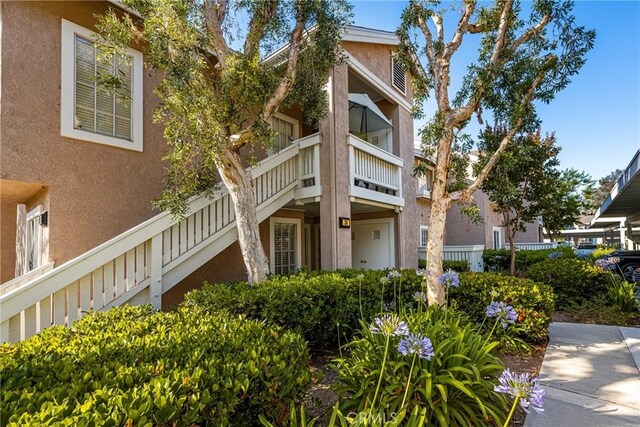 38 Woodleaf, Irvine, CA 92614 - view of front of property with stucco siding and stairway