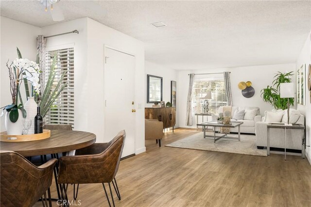 38 Woodleaf, Irvine, CA 92614 - dining area with light wood-style flooring and a textured ceiling