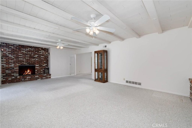 1333 E Tudor St, Covina, CA 91724 - unfurnished living room featuring beam ceiling, ceiling fan, carpet flooring, and a fireplace
