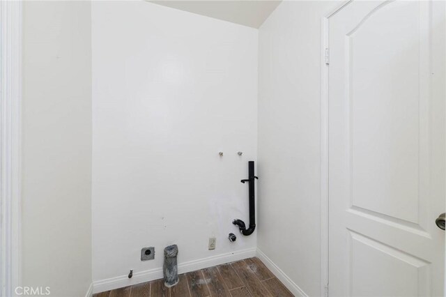 1333 E Tudor St, Covina, CA 91724 - washroom with electric dryer hookup, dark wood-style flooring, washer hookup, and hookup for a gas dryer