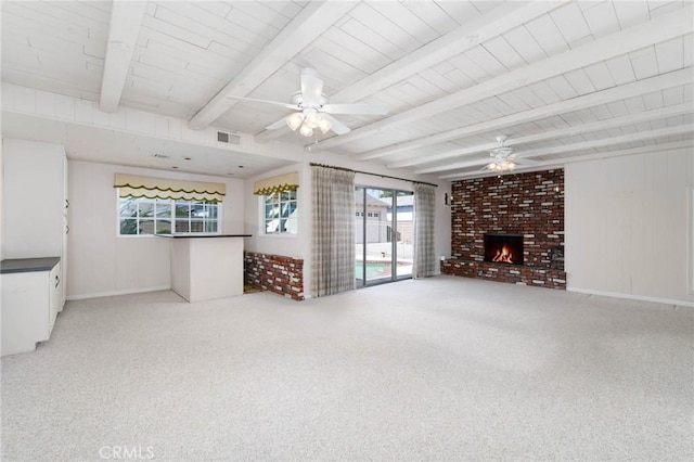 1333 E Tudor St, Covina, CA 91724 - unfurnished living room featuring carpet flooring, ceiling fan, a fireplace, and a wooden ceiling with exposed beams