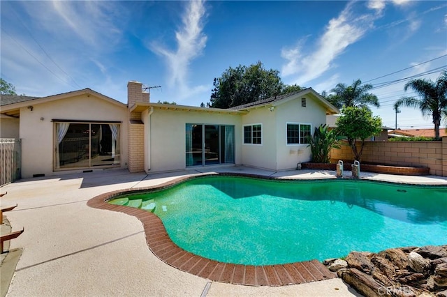 1333 E Tudor St, Covina, CA 91724 - rear view of house with a patio area, a chimney, and stucco siding