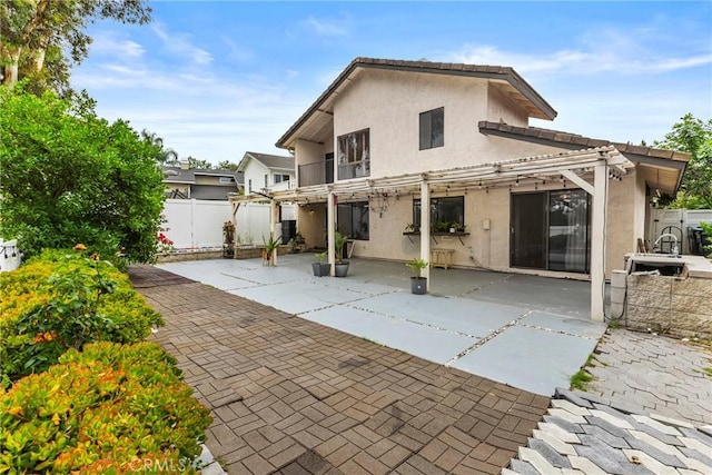 25835 Appian Way, Mission Viejo, CA 92691 - rear view of property with stucco siding, a patio, and a pergola