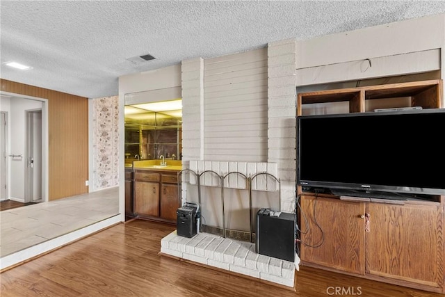 25835 Appian Way, Mission Viejo, CA 92691 - living area featuring a textured ceiling, wood finished floors, and wallpapered walls