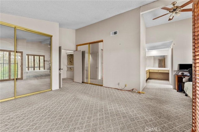 25835 Appian Way, Mission Viejo, CA 92691 - unfurnished bedroom with carpet floors, lofted ceiling, and a textured ceiling