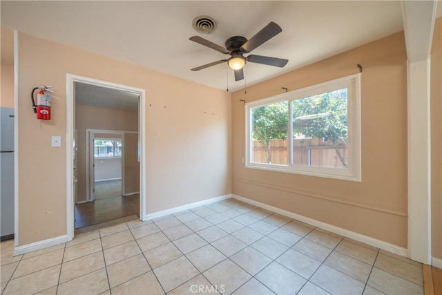 1577 Hawthorne Ave, Chico, CA 95926 - empty room with plenty of natural light, a ceiling fan, and light tile patterned flooring