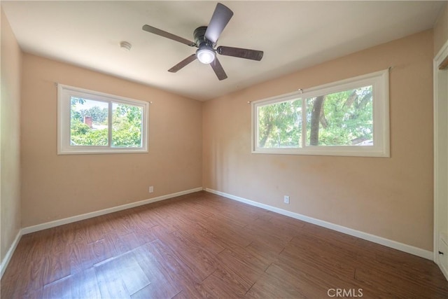 1577 Hawthorne Ave, Chico, CA 95926 - empty room featuring healthy amount of natural light, wood finished floors, a ceiling fan, and a smoke detector