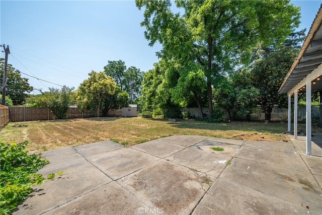 1577 Hawthorne Ave, Chico, CA 95926 - fenced backyard with a patio and a storage unit