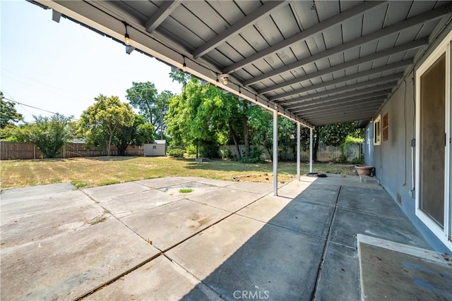 1577 Hawthorne Ave, Chico, CA 95926 - fenced backyard featuring a storage shed and a patio area