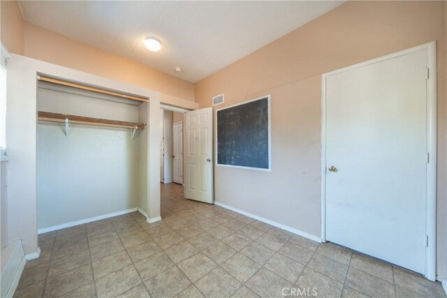 1577 Hawthorne Ave, Chico, CA 95926 - unfurnished bedroom featuring a closet and baseboards