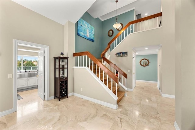 6 Sand Pointe, Laguna Niguel, CA 92677 - staircase featuring marble tiled flooring and a towering ceiling