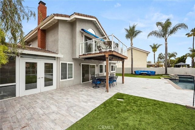 6 Sand Pointe, Laguna Niguel, CA 92677 - rear view of property featuring a balcony, a chimney, stucco siding, french doors, and a patio