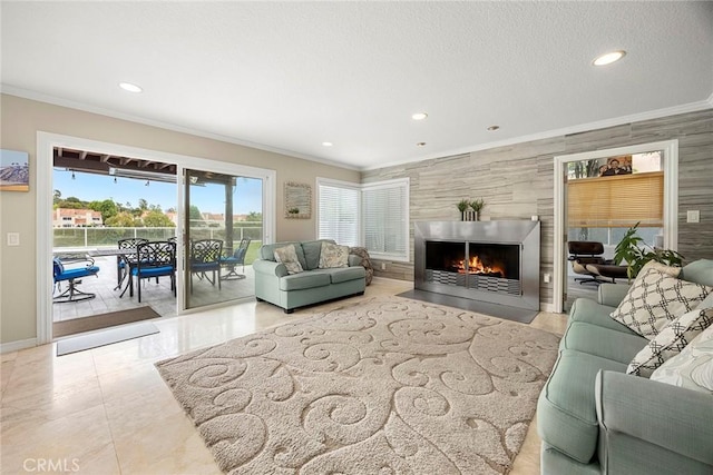 6 Sand Pointe, Laguna Niguel, CA 92677 - living area featuring ornamental molding, recessed lighting, and a fireplace with flush hearth