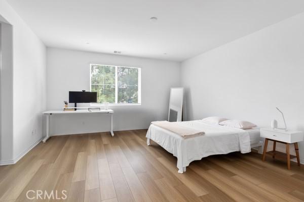 15940 Lasselle St Unit 1, Moreno Valley, CA 92551 - bedroom with light wood finished floors and an office area