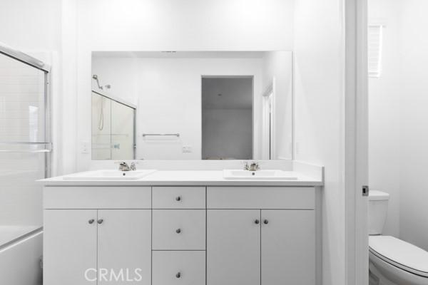 15940 Lasselle St Unit 1, Moreno Valley, CA 92551 - bathroom with double vanity and toilet
