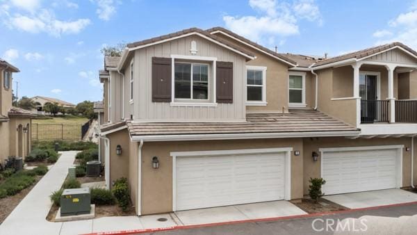 15940 Lasselle St Unit 1, Moreno Valley, CA 92551 - townhome / multi-family property with a garage and stucco siding