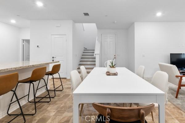 15940 Lasselle St Unit 1, Moreno Valley, CA 92551 - dining room with stairway and recessed lighting