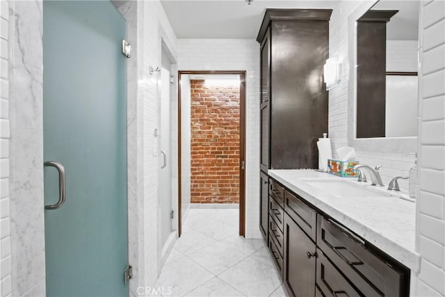 201 E Broadway, Long Beach, CA 90802 - full bath featuring vanity, a stall shower, tile patterned floors, and brick wall