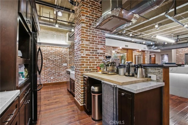 201 E Broadway, Long Beach, CA 90802 - kitchen featuring brick wall, dark wood-type flooring, dark brown cabinetry, island range hood, and butcher block countertops