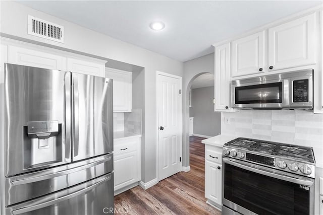 21751 Lanar, Mission Viejo, CA 92692 - kitchen featuring stainless steel appliances, arched walkways, light countertops, decorative backsplash, and recessed lighting